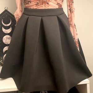 Black pleated skirt by Charlotte Russe size M